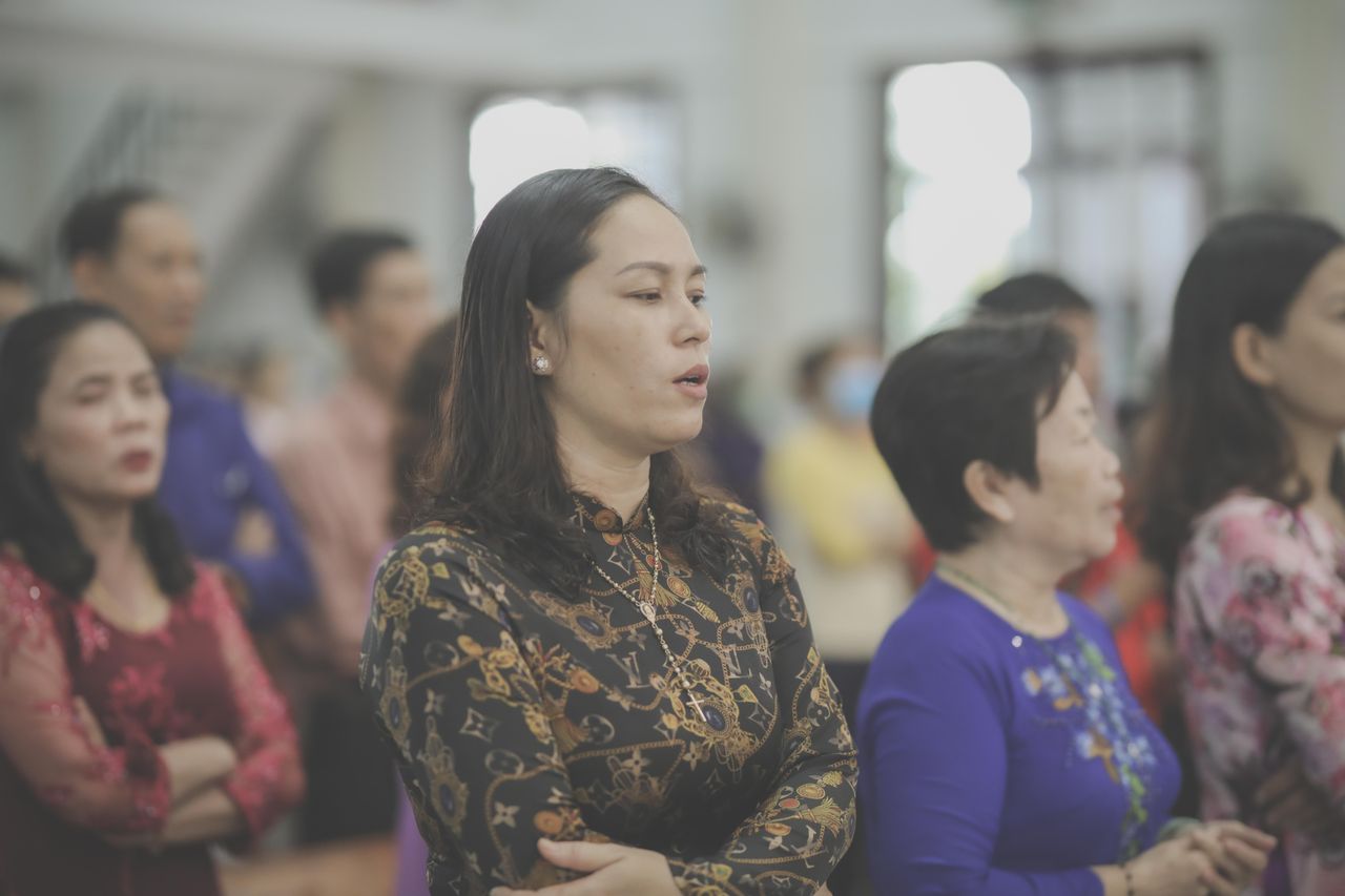 Menus A group of people attentively participating in a church service, embodying community and faith.